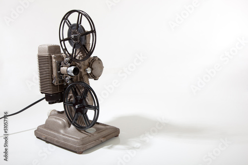 A vintage movie projector on a white background with copy space photo