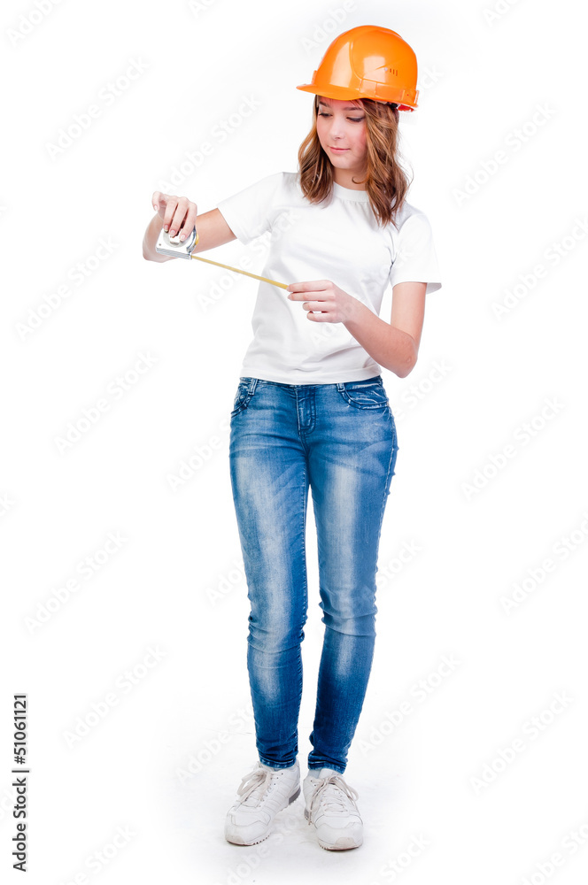 beautiful girl in a building helmet and tools in hand beautiful girl in a building helmet and tools in hand