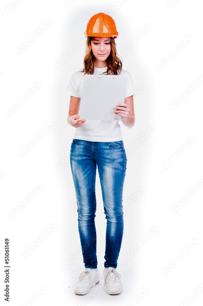 beautiful girl in a building helmet and tools in hand beautiful girl in a building helmet and tools in hand