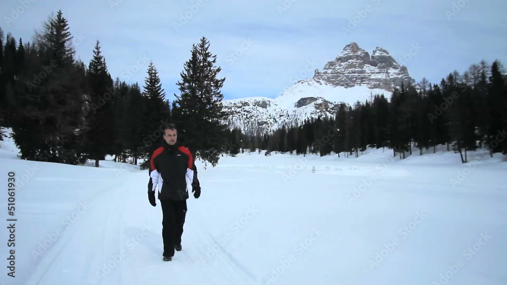 Man walking on the snow Man walking on the snow