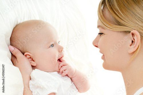 happy mother with baby over white