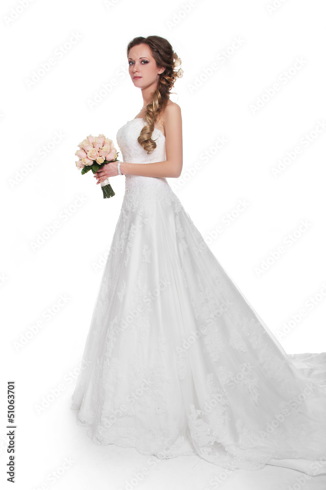Beautiful bride in luxurious wedding dress isolated on white bac Beautiful bride in luxurious wedding dress isolated on white bac