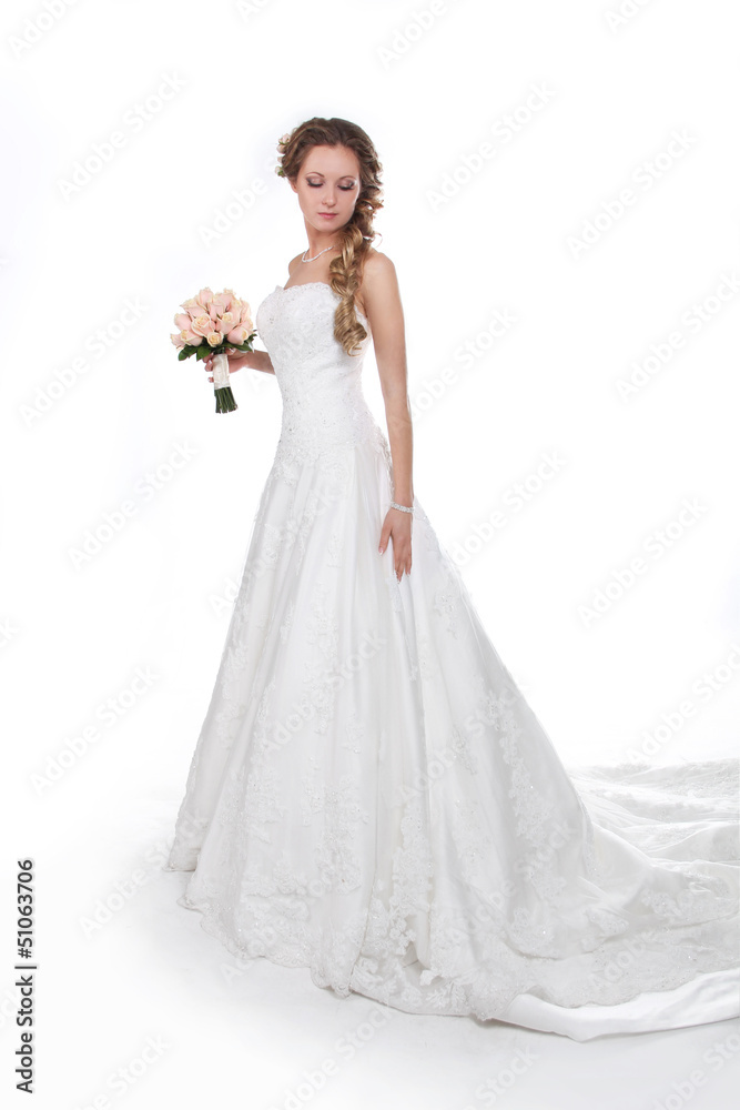 Beautiful bride in luxurious wedding dress isolated on white bac Beautiful bride in luxurious wedding dress isolated on white bac