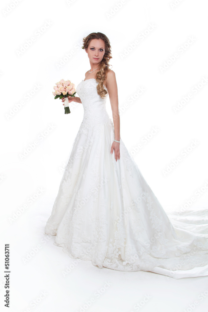 Beautiful bride in luxurious wedding dress isolated on white bac Beautiful bride in luxurious wedding dress isolated on white bac
