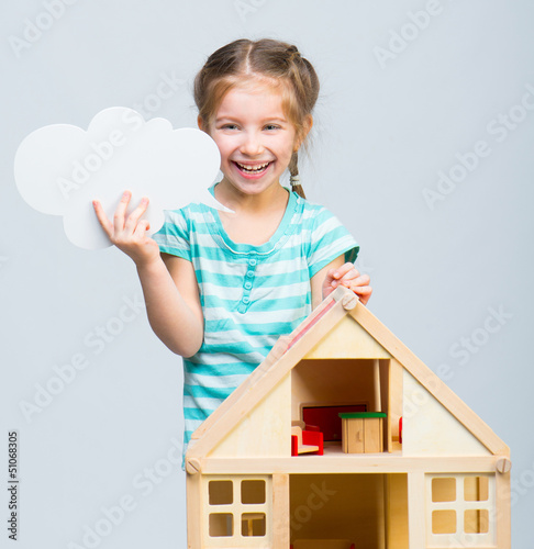 girl with a toy house
