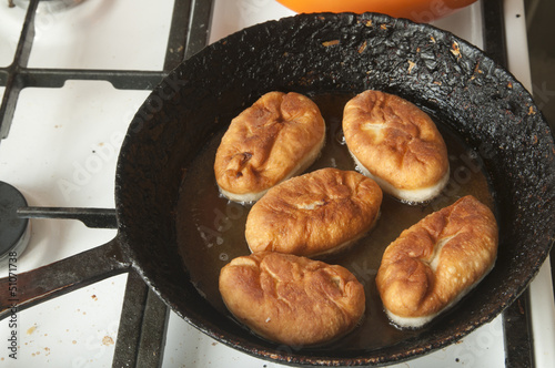 Pies on a frying pan photo