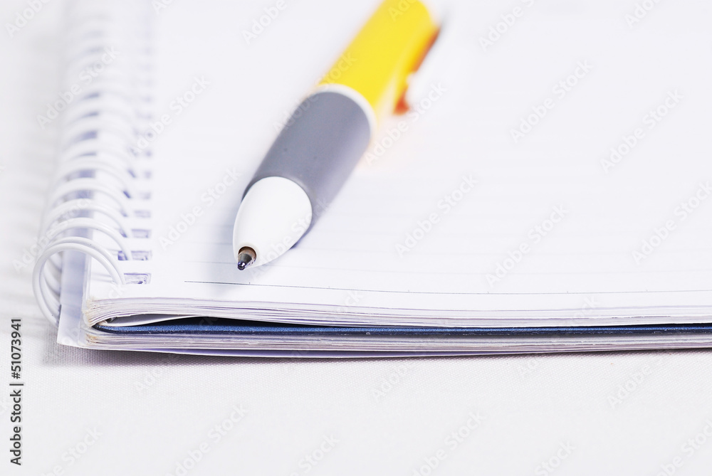 Blank note paper with yellow pen Blank note paper with yellow pen