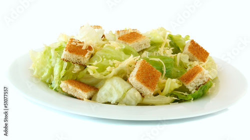 Caesar salad on white plate