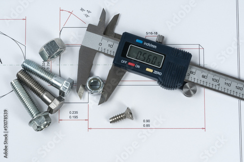 Vernier caliper and assorted screw, nuts and bolts photo