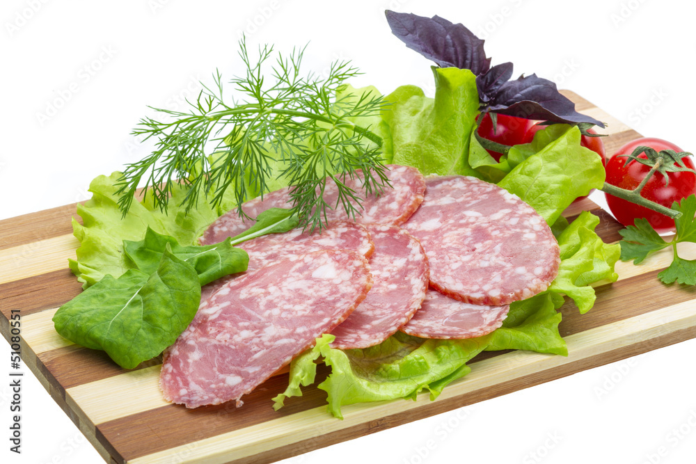 Sausages with salad and basil