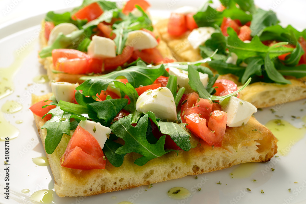 Focaccia with tomatoes, rocket, mozzarella and olives Focaccia with tomatoes, rocket, mozzarella and olives
