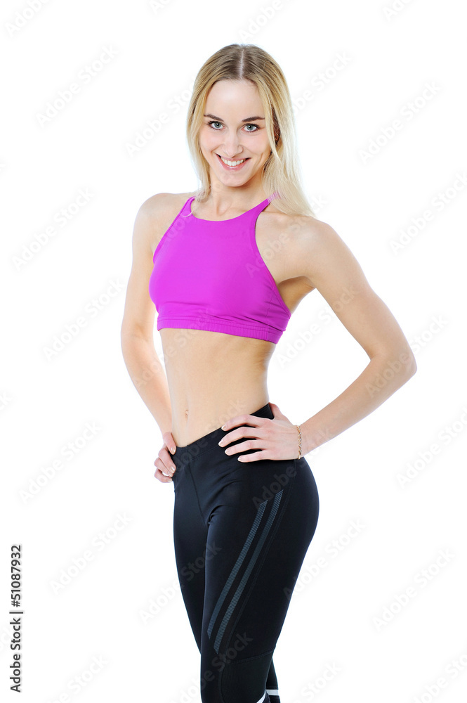 Beautiful healthy fitness woman posing isolated on white Beautiful healthy fitness woman posing isolated on white