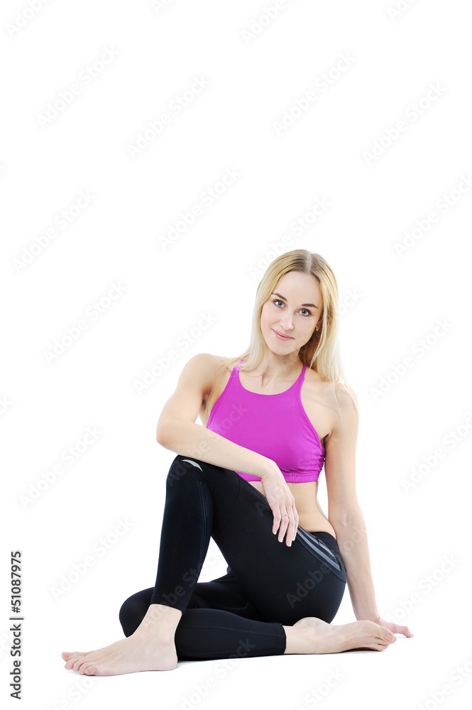 Beautiful healthy fitness woman posing isolated on white