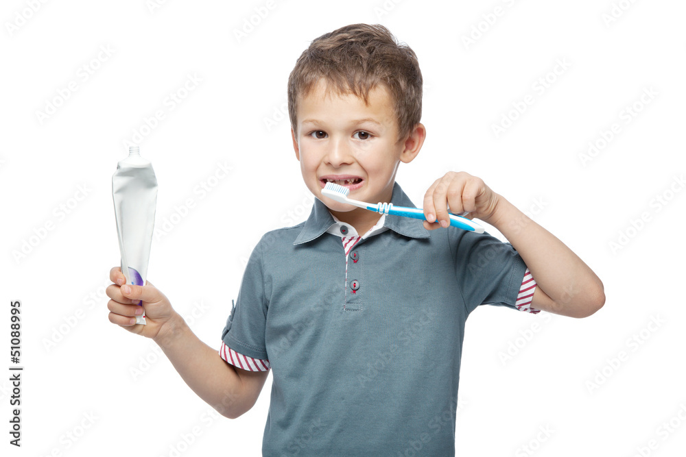 Cute little boy brushing teeth, isolated on white Cute little boy brushing teeth, isolated on white