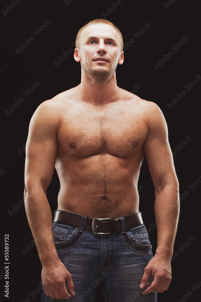 Fototapeta premium man excersizing with dumbbells