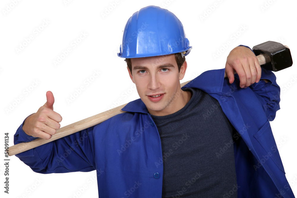 portrait of junior carpenter with hammer