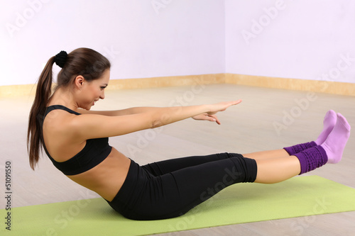 Young woman doing fitness e...