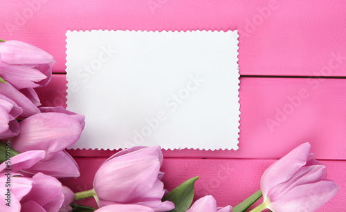 Fototapeta Naklejka Na Ścianę i Meble -  Beautiful bouquet of purple tulips and blank card