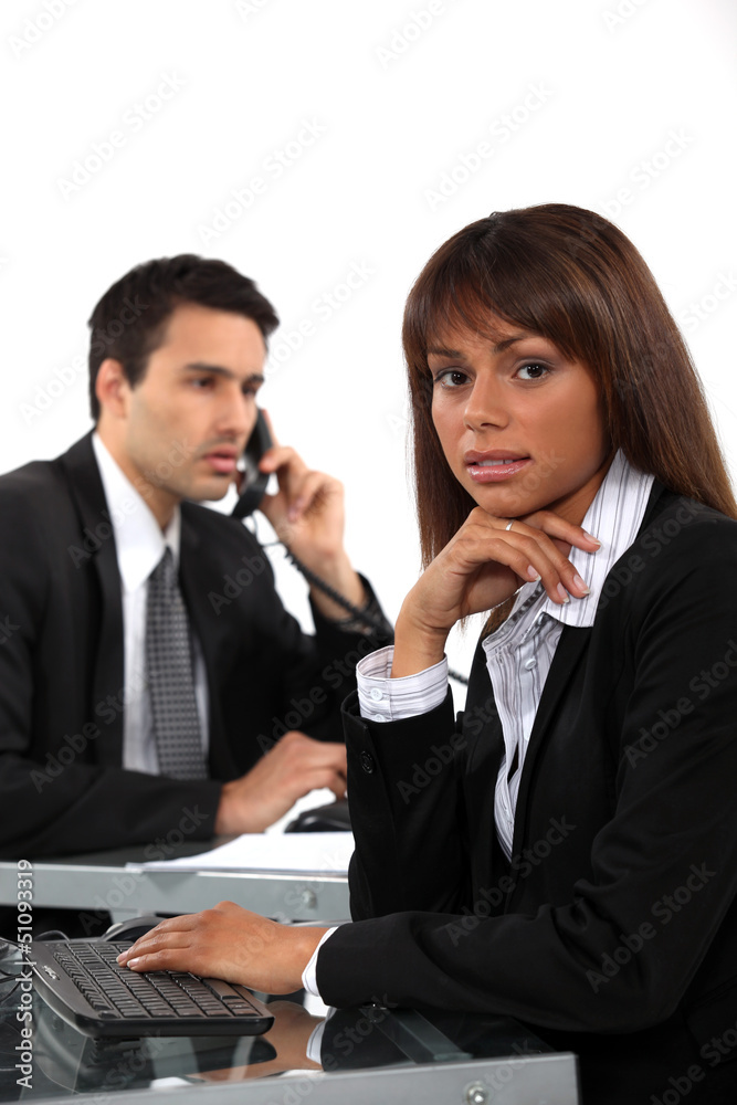 Two business colleagues working side by side Two business colleagues working side by side