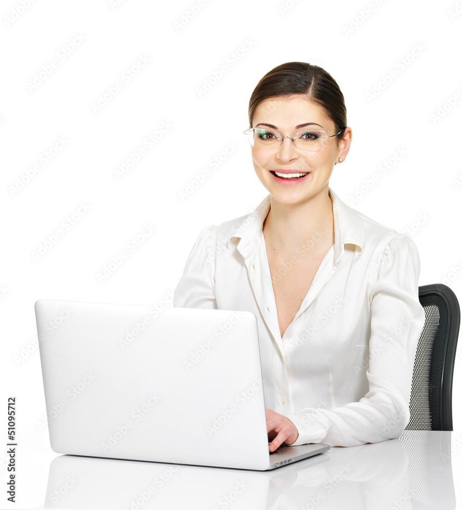 woman sits from the table with laptop in white shirt woman sits from the table with laptop in white shirt