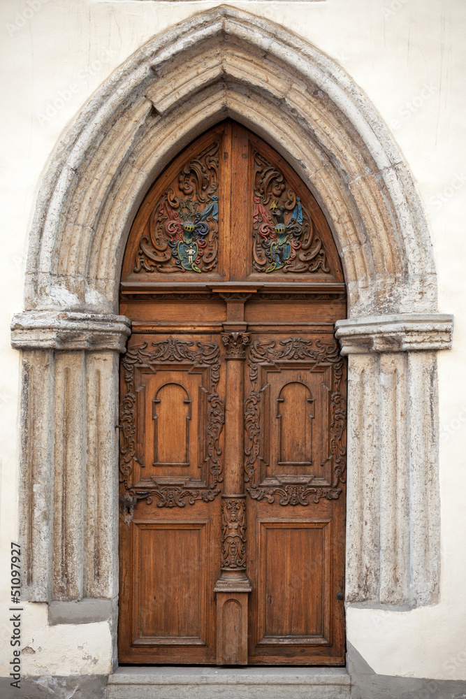 Ancient wooden door with decoration elements. Tallinn, Estonia
