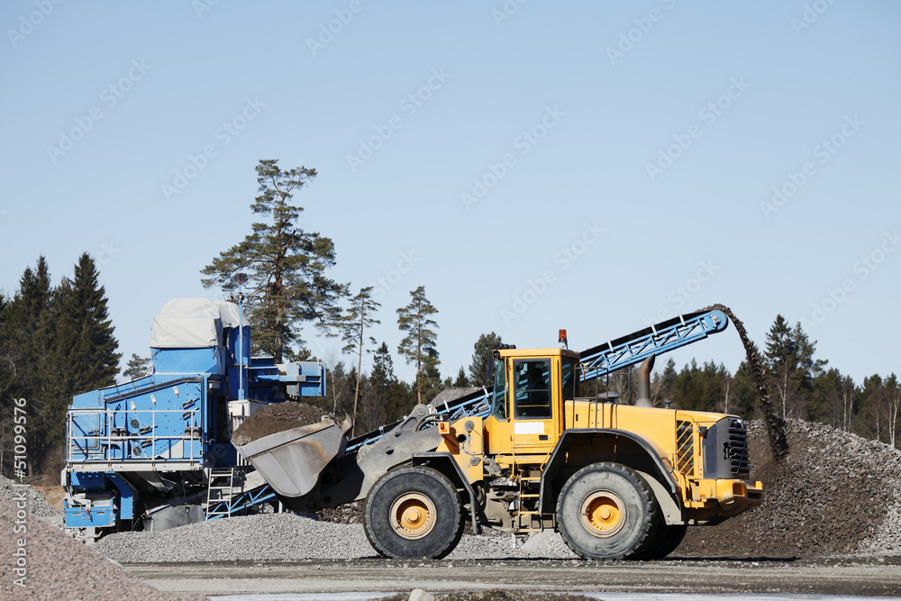 heavy truck working inside gravel and sand industry