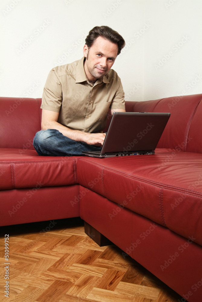 Man doing some laptop worh at home