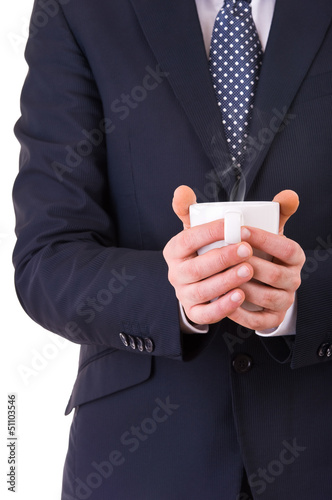 Businessman holding a cup of coffee.