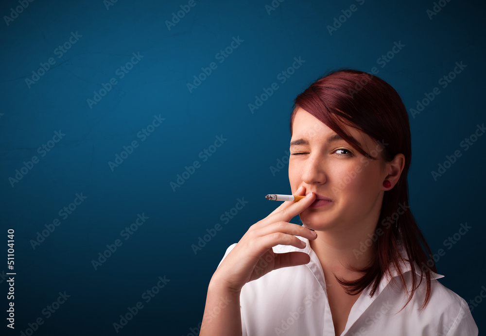 Beautiful woman smoking cigarette vith copy space Beautiful woman smoking cigarette vith copy space