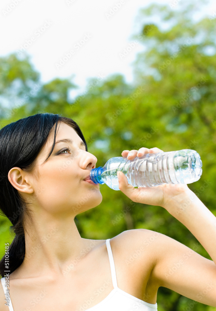 Portrait of woman drinking water outdoor Portrait of woman drinking water outdoor