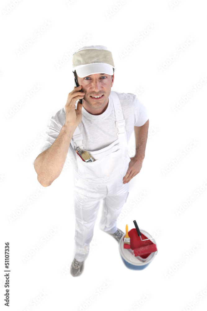 high angle shot of painter making a call high angle shot of painter making a call