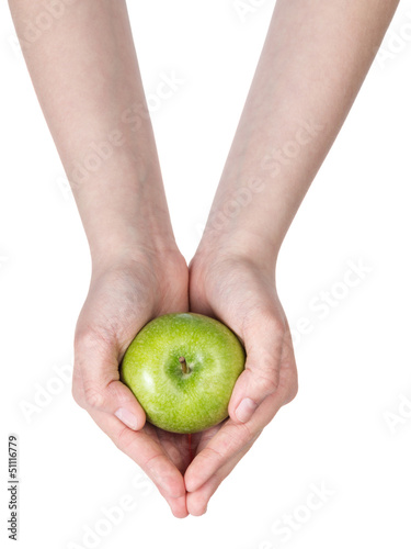 female teen hands holding green apple