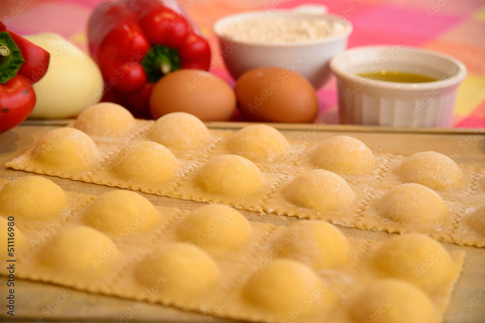 Homemade raviolis with ingredients.