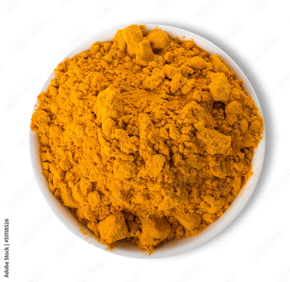 Turmeric powder in plate Turmeric powder in plate