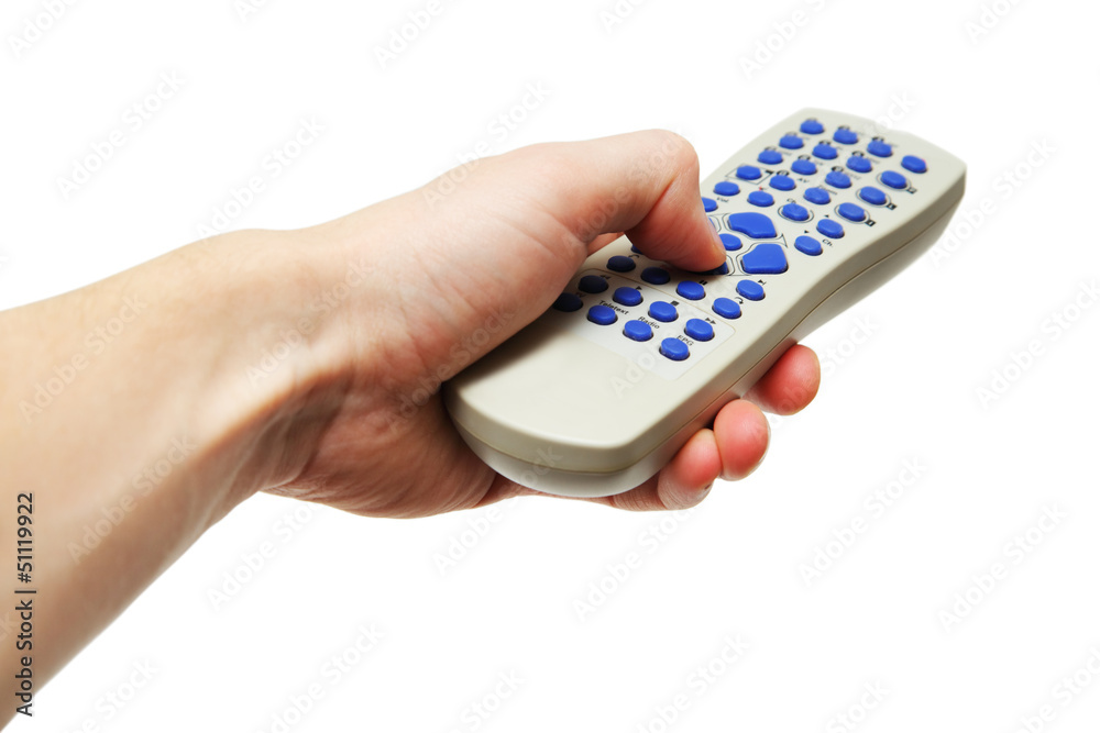 Hand holding gray remote control with blue buttons Hand holding gray remote control with blue buttons