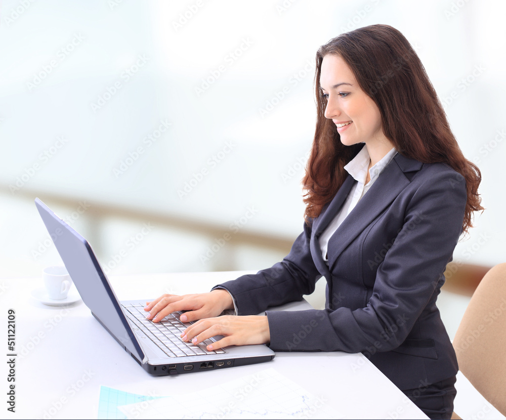 Thoughtful business woman in the office for a laptop Thoughtful business woman in the office for a laptop