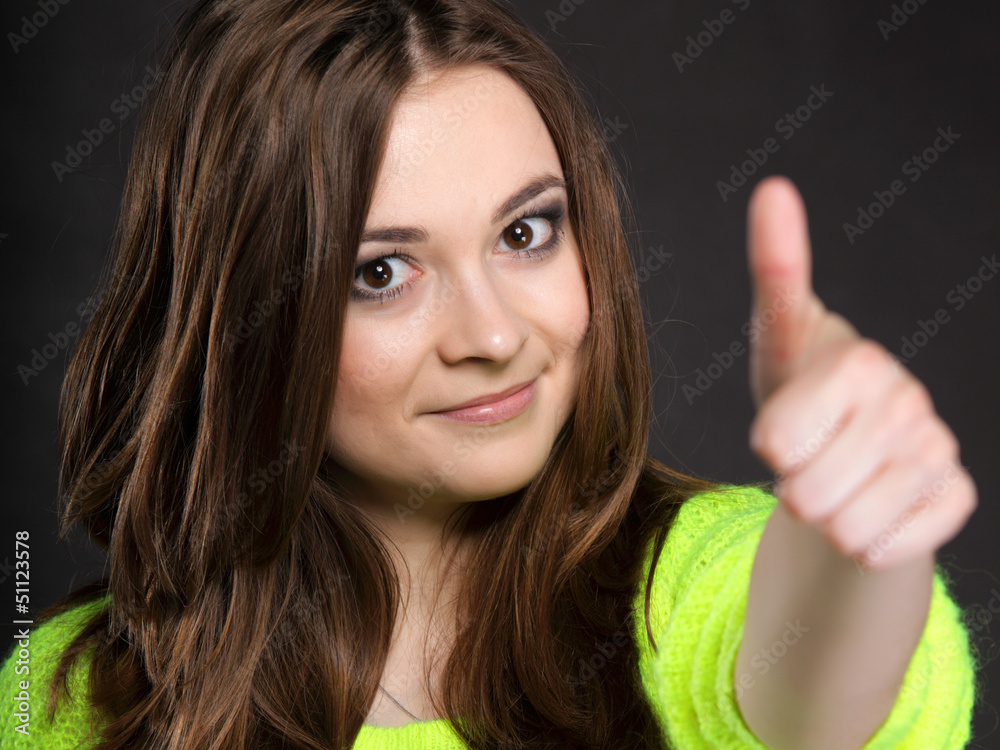 Happy smiling woman with thumb up gesture Happy smiling woman with thumb up gesture