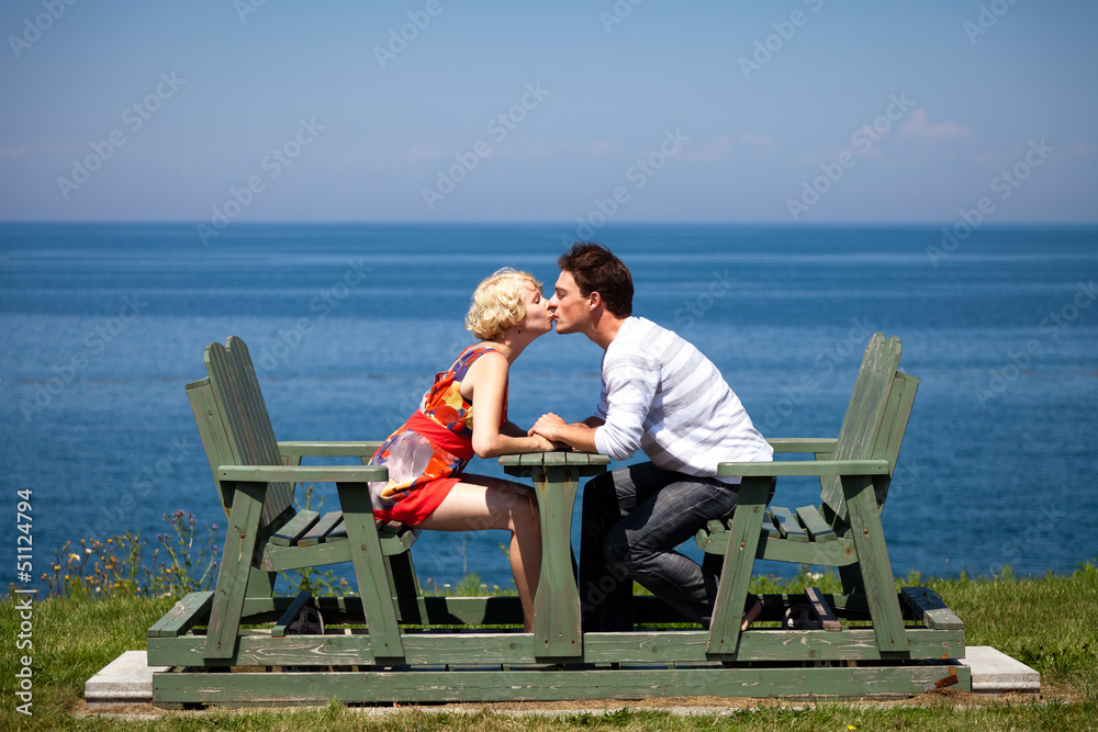 Fototapeta premium Romantic couple sitting on the bench