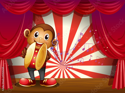 A monkey with cymbals and musical notes at the stage