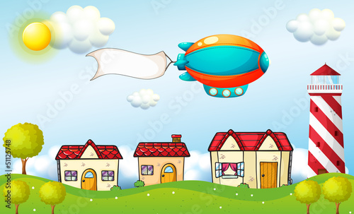 An aircraft with a signage above the village