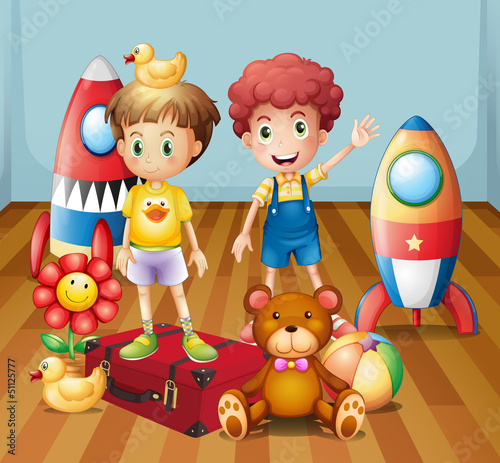 Two boys surrounded with toys