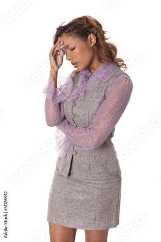 Woman in business attire is stressed out.