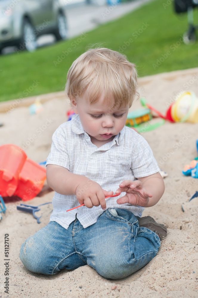 Naklejka premium Small boy playing