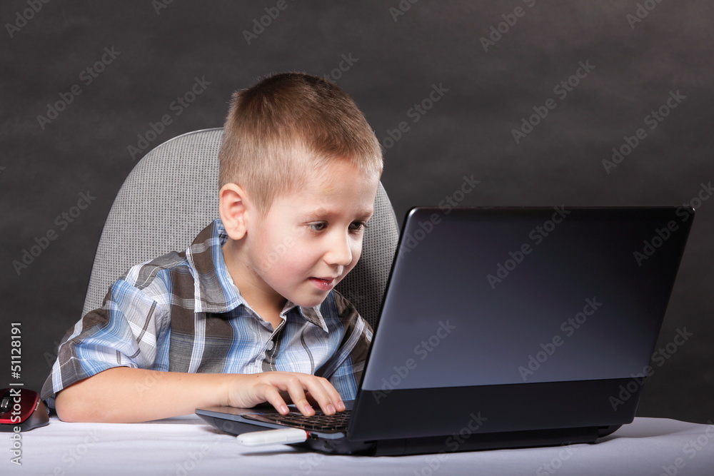 Computer addiction child with laptop notebook Computer addiction child with laptop notebook