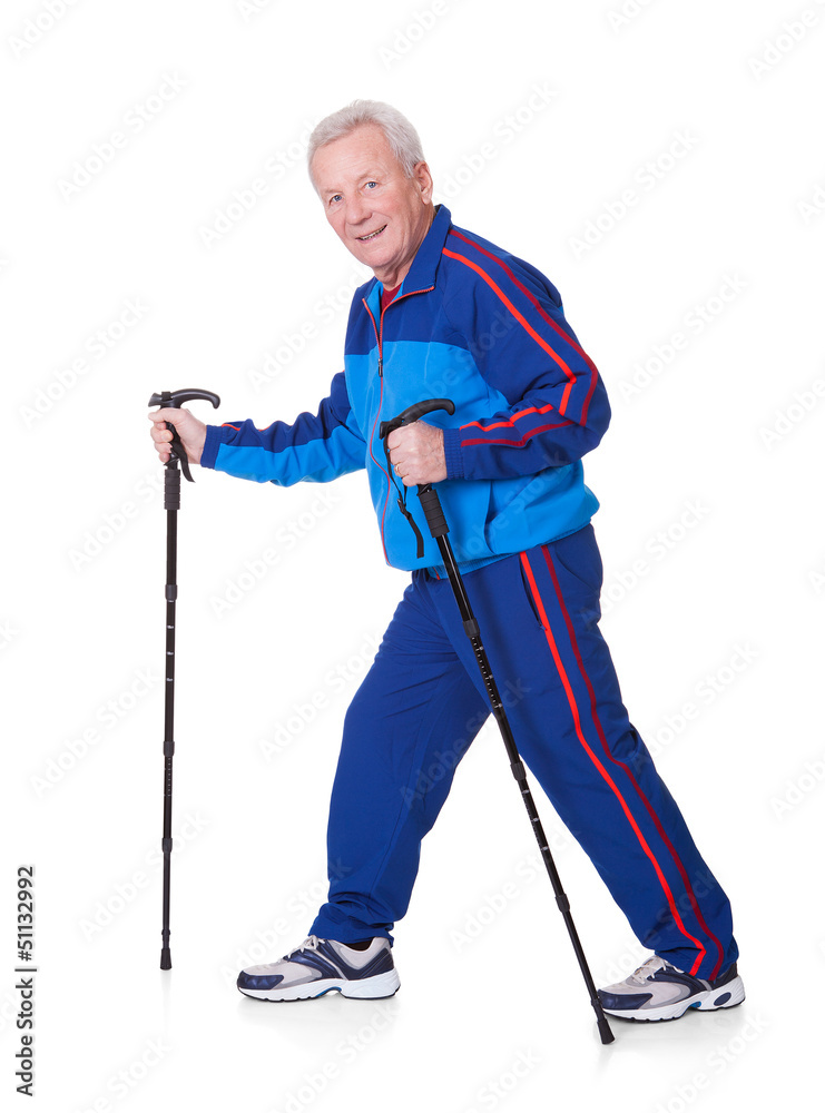 Senior Man Walking With Hiking Poles Senior Man Walking With Hiking Poles