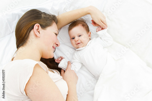 mother with baby in bed