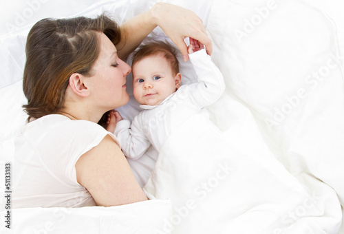 mother with baby in bed
