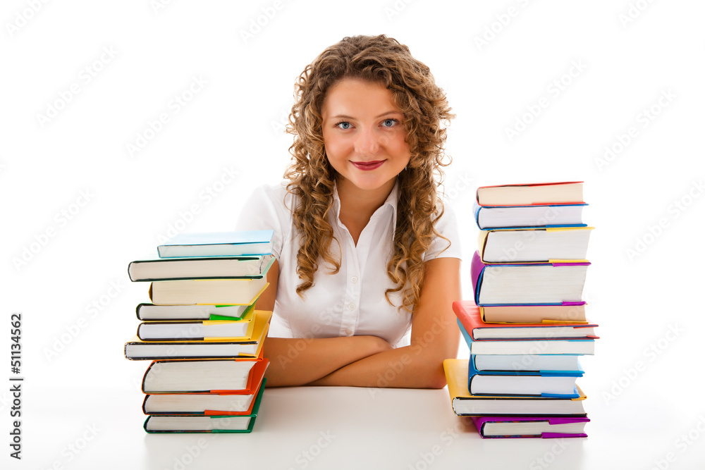 Young woman behind pile of books isolated on white background Young woman behind pile of books isolated on white background