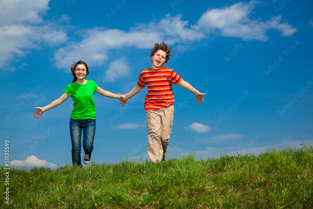 Girl and boy running, jumping outdoor Girl and boy running, jumping outdoor