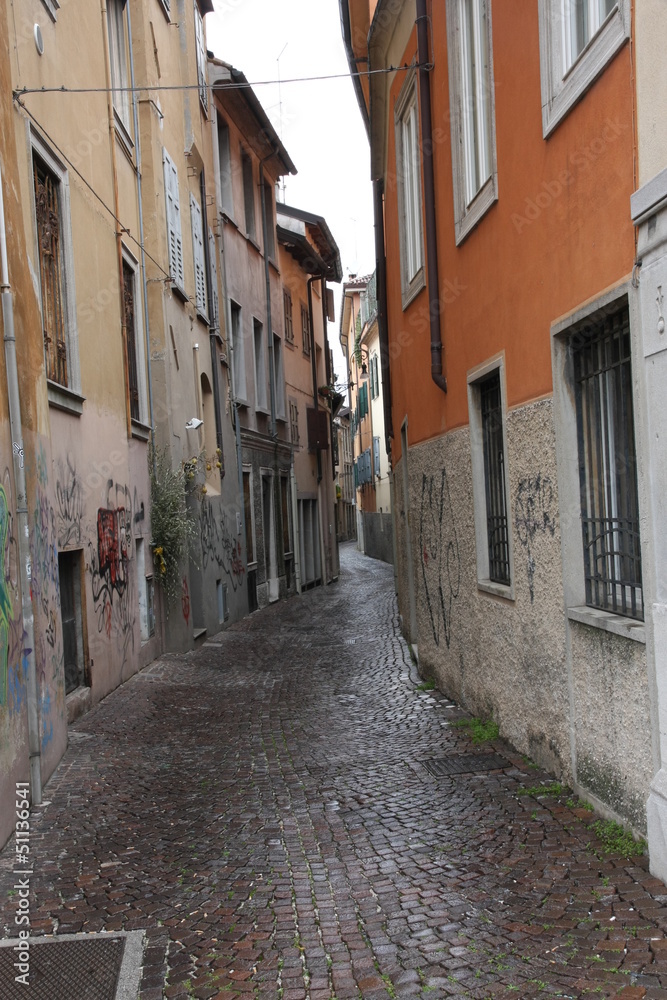 narrow street with houses and housing part for part in a Italian